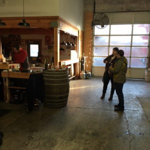 The large window door rolls up letting the TapRoom open to the outdoors