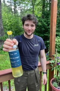 Cider Chat Episode 412 Eli holding a bottle of Punta de Fierro