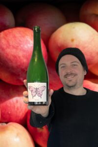 Cider Chat Ep 492 feature photo Absolem Cider Company Zach holding a bottle of WEND