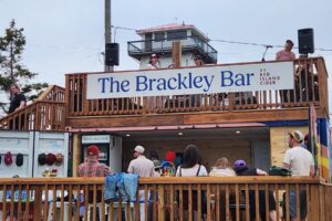 Guests enjoy live music at The Brackley Bar, Red Island Cider's new cider-focused destination in Prince Edward Island.