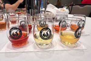 GLINTCAP cider judging table with tasting glasses filled with ciders of different colors during the 2026 Great Lakes International Cider and Perry Competition.